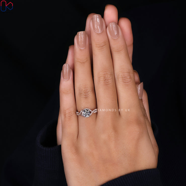 Diamondsbyuk ring with twisted halo and pave accents.
