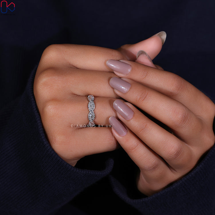 Half eternity wedding band showcasing dazzling diamonds in a perfect row.
