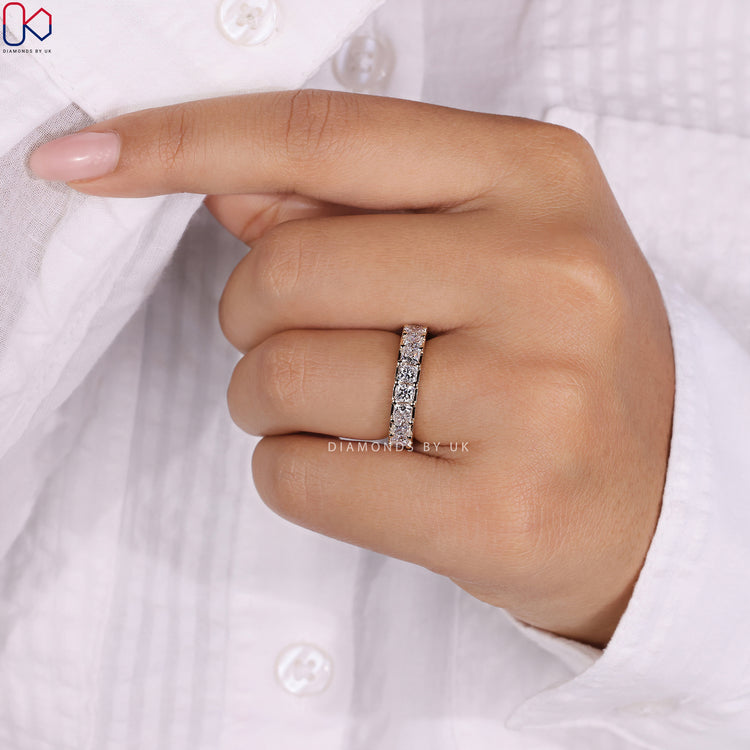 Handmade ring featuring a princess cut eternity band with precision craftsmanship.
