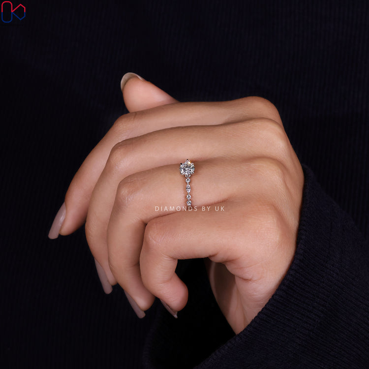 Engagement ring UK with a round cut diamond ring and a 4 prong claw setting.
