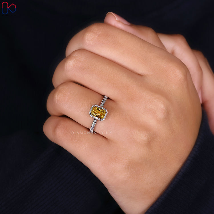 Halo diamond ring with yellow centre diamond.

