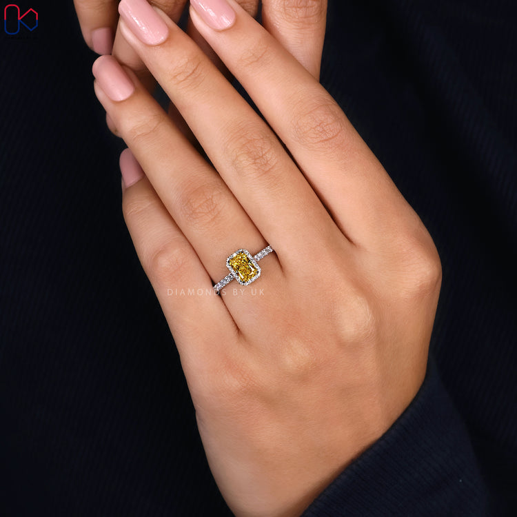 Round cut pave band ring with radiant cut centre.
