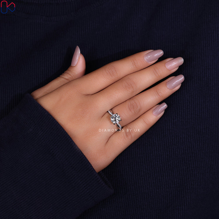 Handmade ring with a brilliant round diamond engagement ring in a twisted band.
