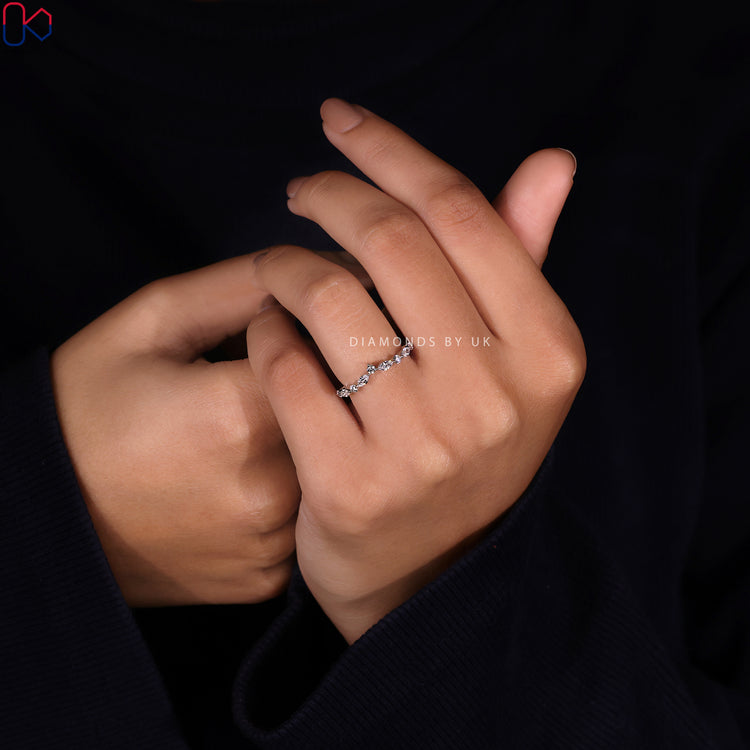 Marquise and round diamond band designed for a seamless fit with other rings.
