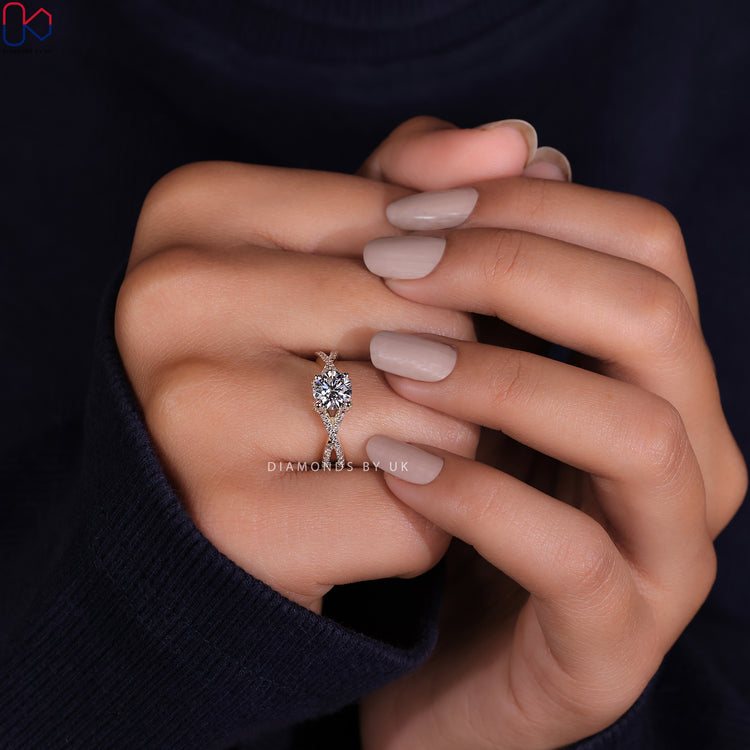 IGI certified twisted band ring with a stunning round cut diamond ring.