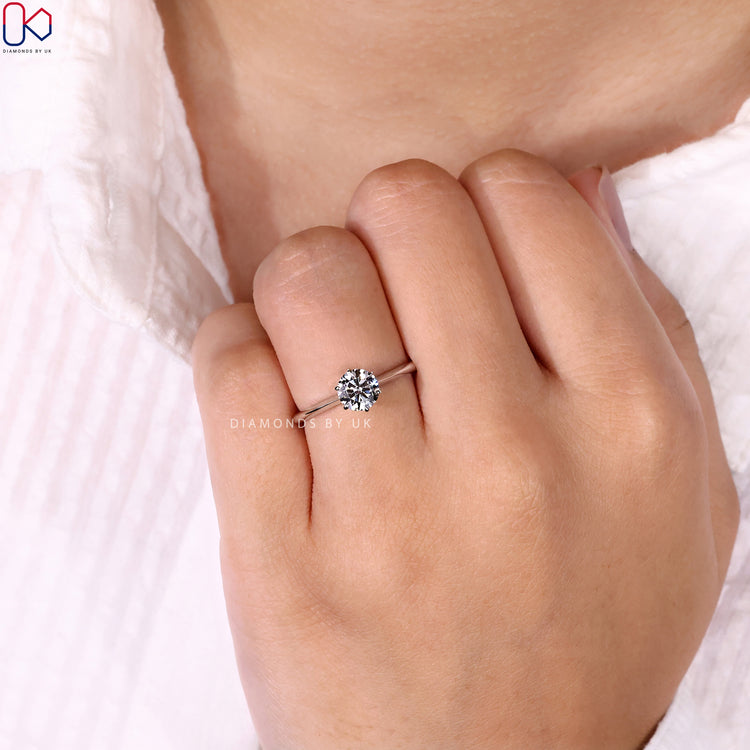 White gold engagement ring featuring a 6-prong setting.
