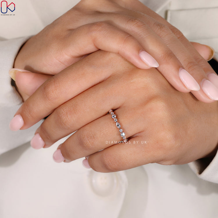 Handmade band featuring marquise and round lab grown diamonds.
