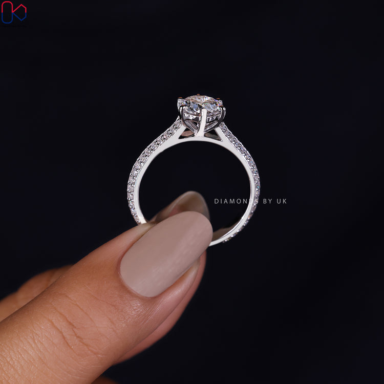 Diamondsbyuk ring featuring a stunning round cut diamond ring with pave details.