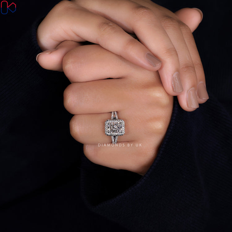 Radiant cut diamond ring in a split shank pave engagement ring design.