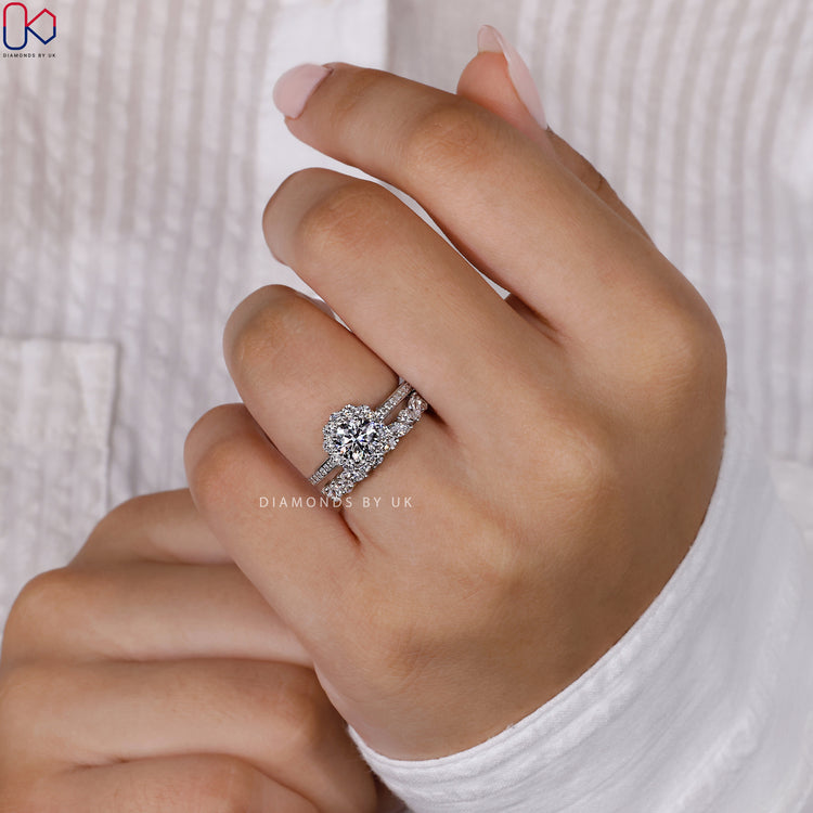 Marquise and round cut wedding band complementing a White Gold engagement ring with a halo setting.
