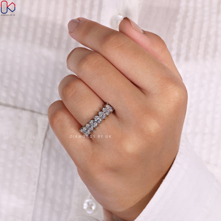 Prong set wedding band offering secure diamond placement and dazzling sparkle.