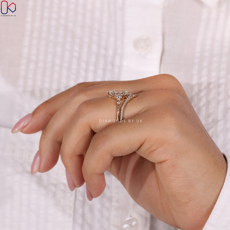 Curvy wedding band complementing the marquise engagement ring.
