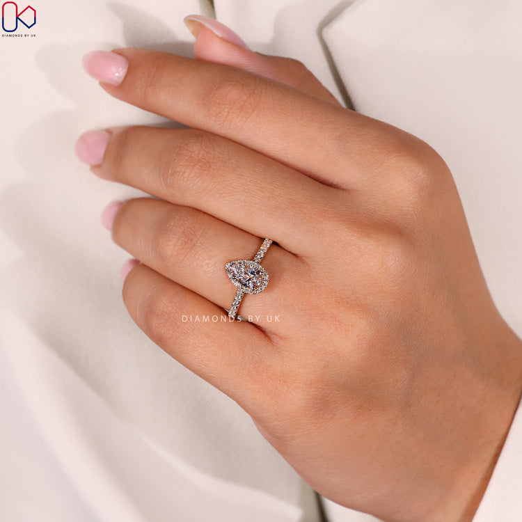 Diamondsbyuk engagement ring with a pear shaped diamond and pave diamond ring design.
