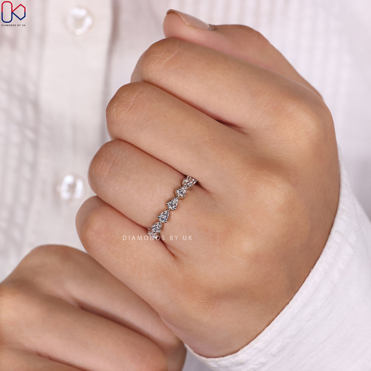 Prong set wedding band ensuring secure and radiant diamonds for everyday wear.