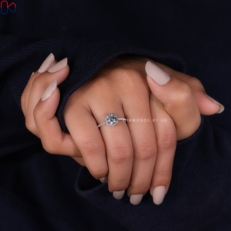 Beautiful handmade jewellery with a round cut diamond in a halo ring design.
