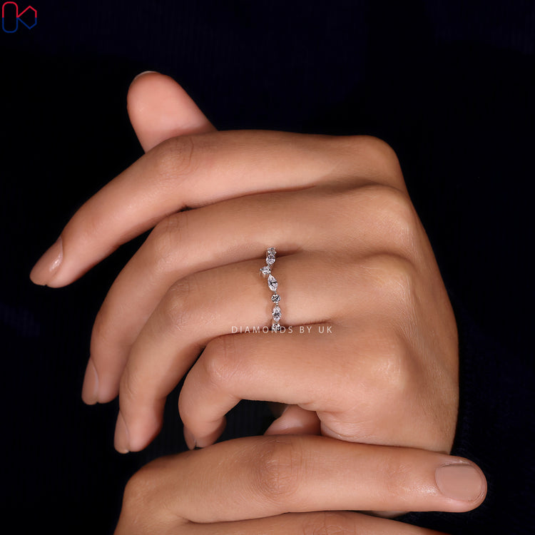 Prong setting band designed to showcase diamonds with maximum brilliance.
