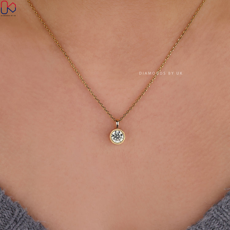 Shop diamond solitaire pendant in yellow gold.
