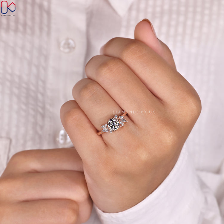 Buy diamond ring with marquise and round side stones.

