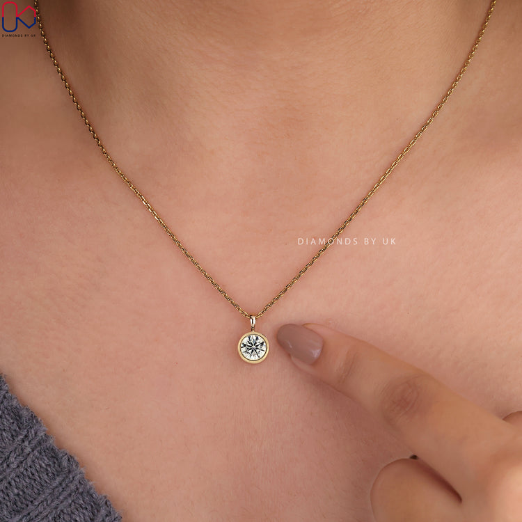 Handmade pendant featuring a round diamond stone.
