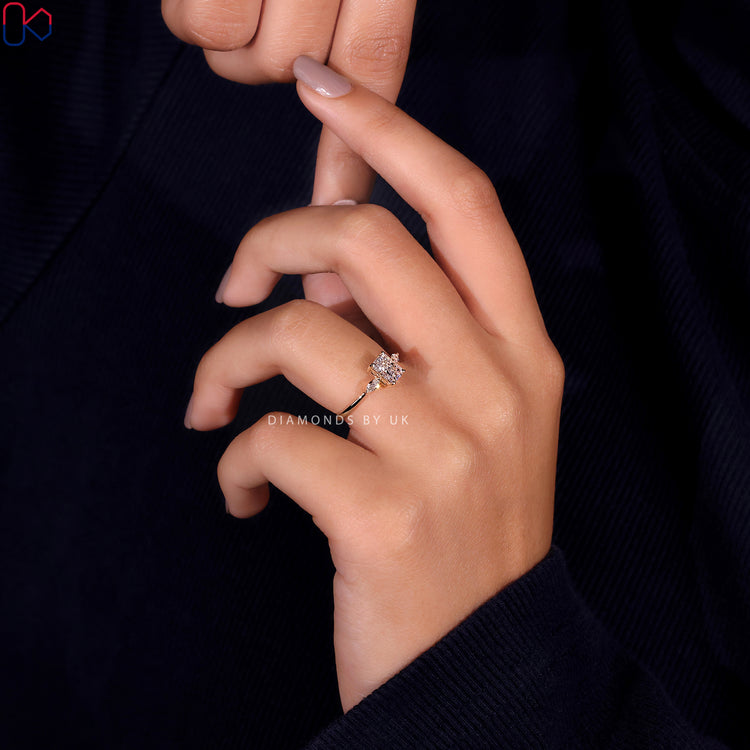 Shop to buy engagement ring featuring a marquise cut ring with radiant cut side stones.
