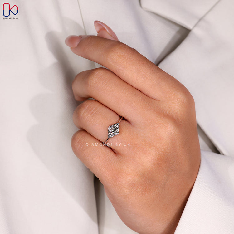 Diamondsbyuk ring showcasing a high-quality Oval Diamond Engagement Ring with round side stones.
