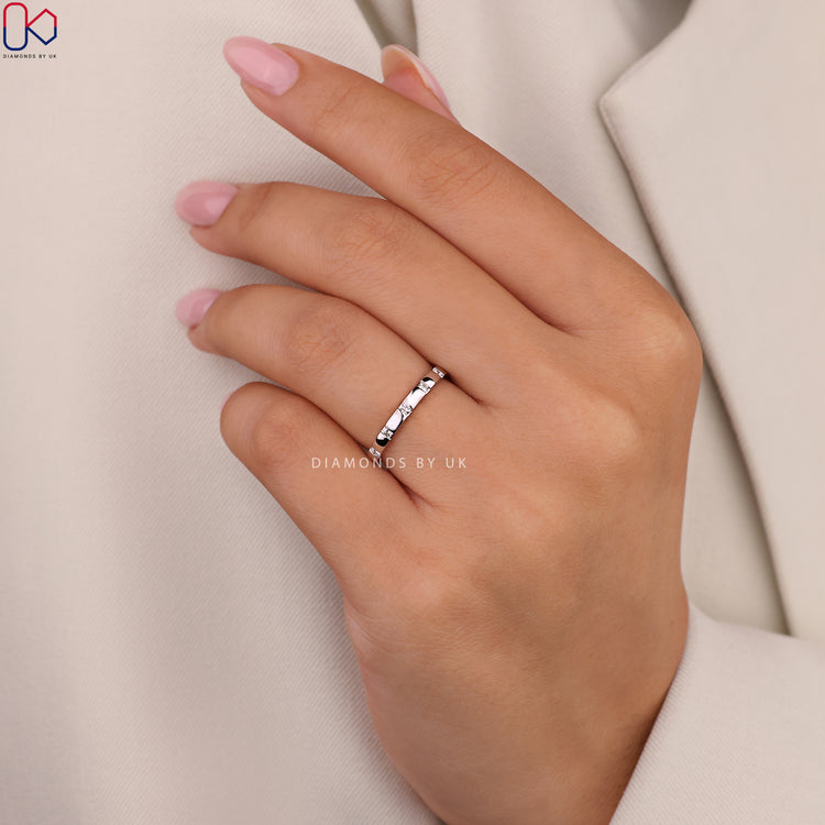 Handmade white gold wedding ring with round diamonds.
