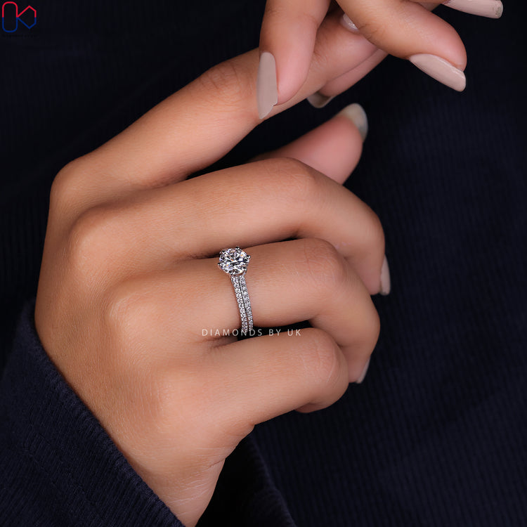 Prong setting ring showcasing a radiant round cut diamond ring.