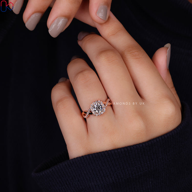Twisted pave band engagement ring with round diamond.
