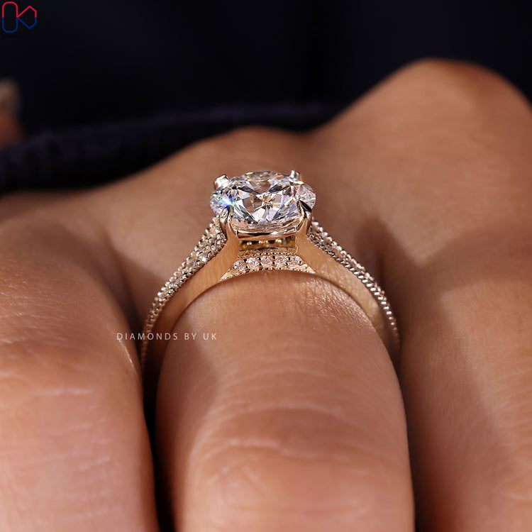 Diamondsbyuk engagement ring featuring a round brilliant cut diamond ring centre and tapered band.