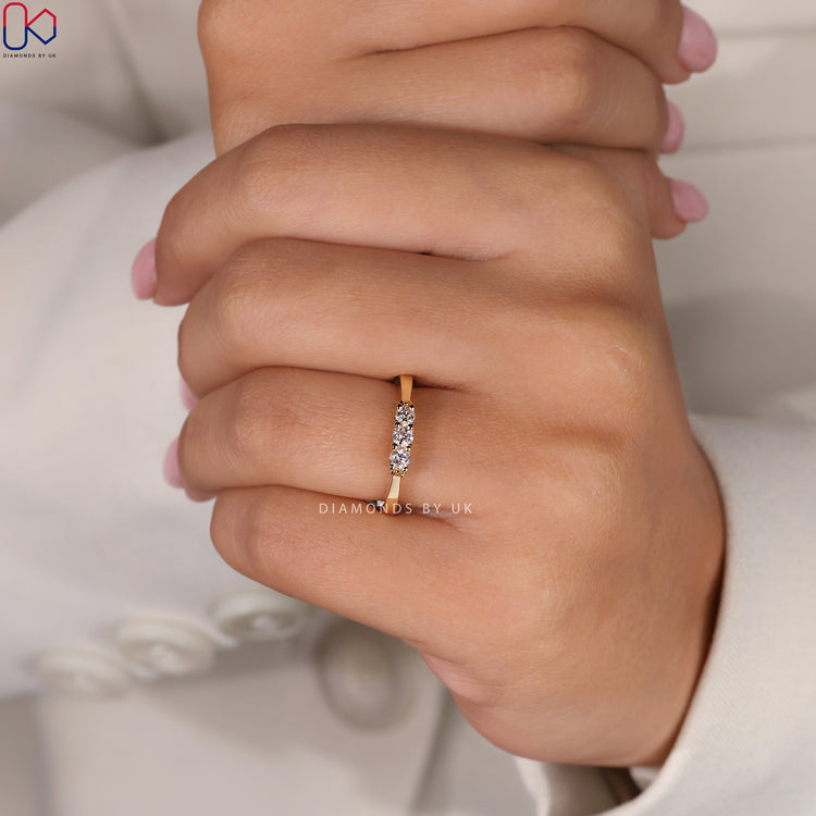 Handmade band with round diamonds and tapered design.
