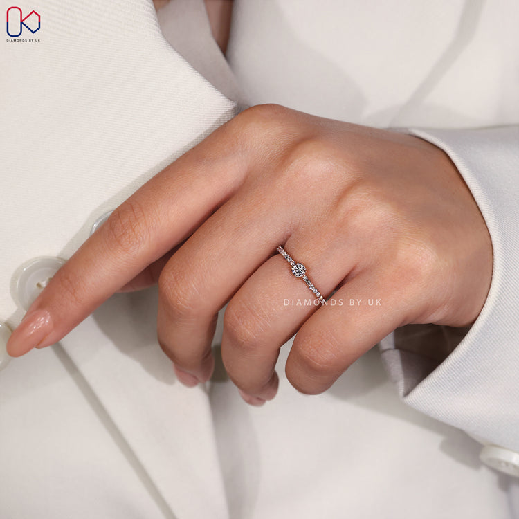 Pave setting ring in a rose gold ring design, showcasing a brilliant round diamond engagement ring.
