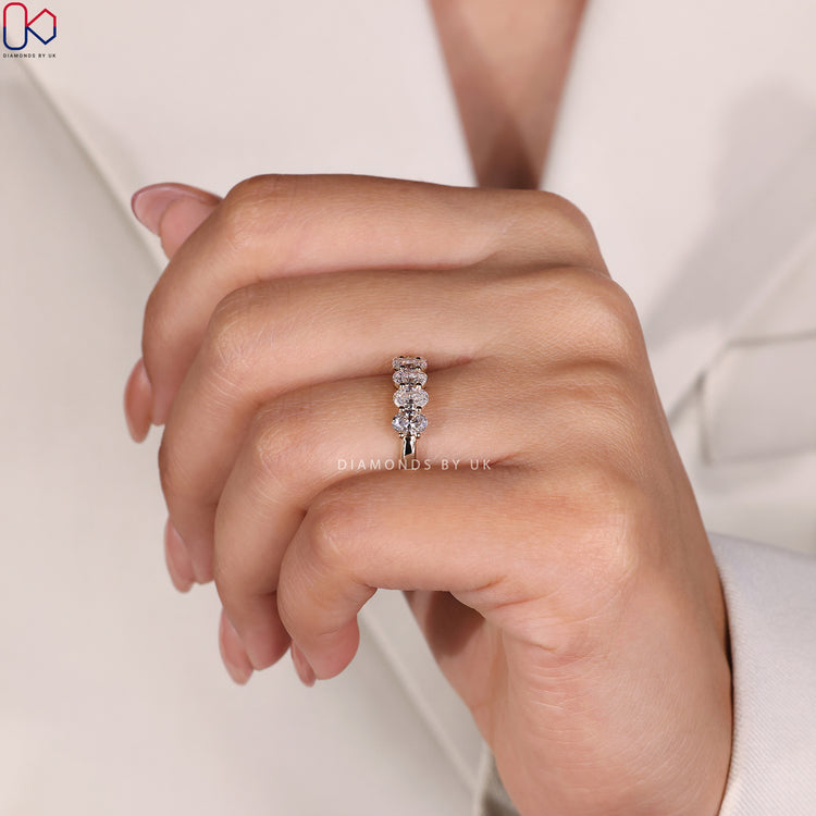 Prong set band featuring oval diamonds for a secure and radiant shine.
