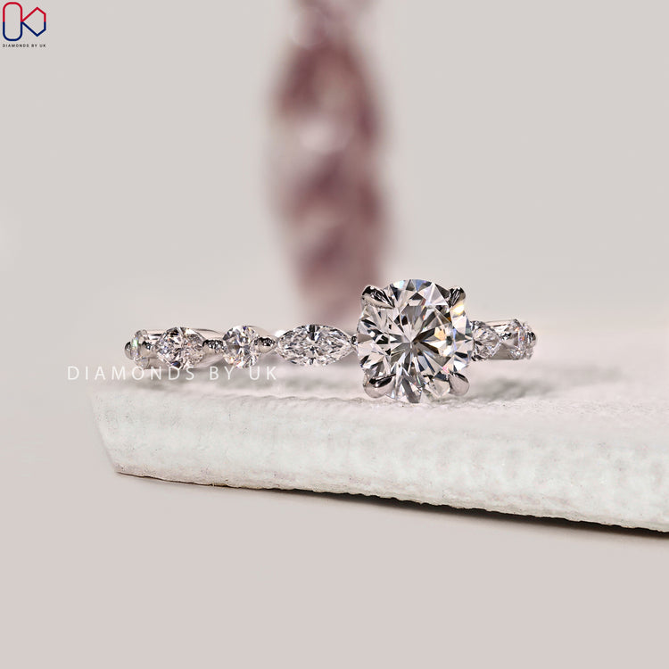 Shared prong setting with marquise and round accents.

