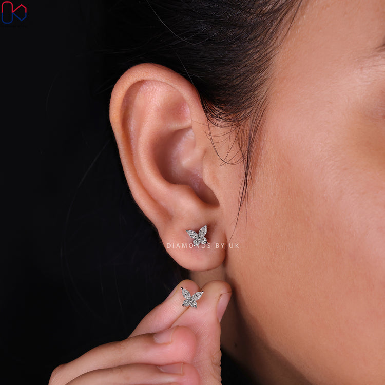 Elegant Butterfly Stud Earrings with shimmering diamonds.
