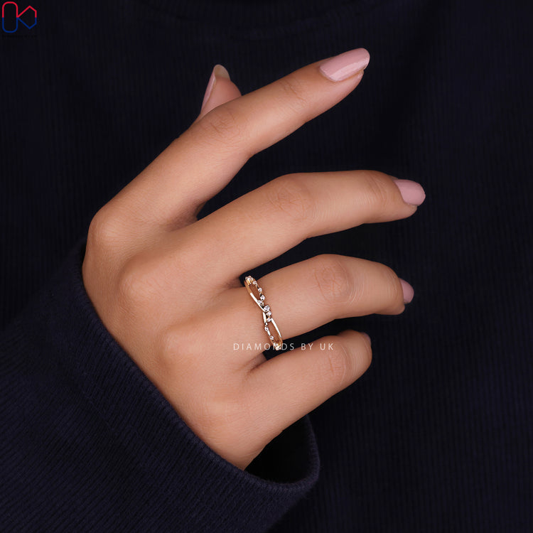 Diamondsbyuk wedding band with a sleek design.
