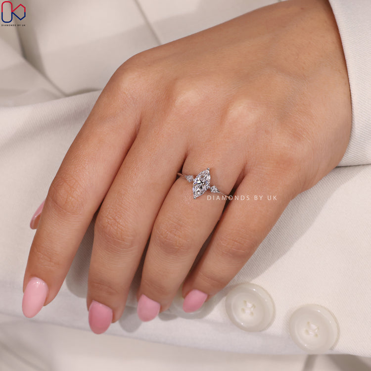 Knife Edge Band Marquise and Round Diamond Engagement Ring.
