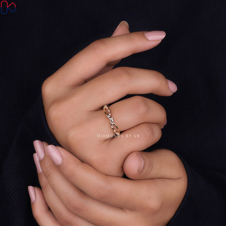 Yellow gold wedding band with round diamonds.
