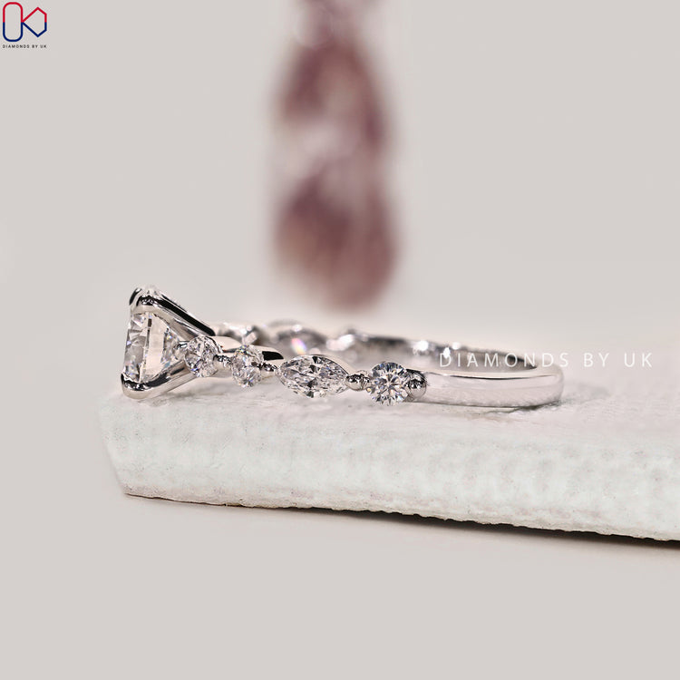 White gold engagement ring with round cut center stone.

