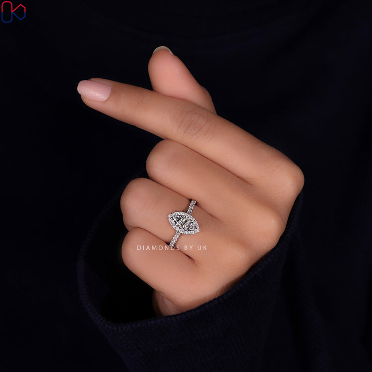 Cathedral setting ring with a marquise diamond for a unique design.
