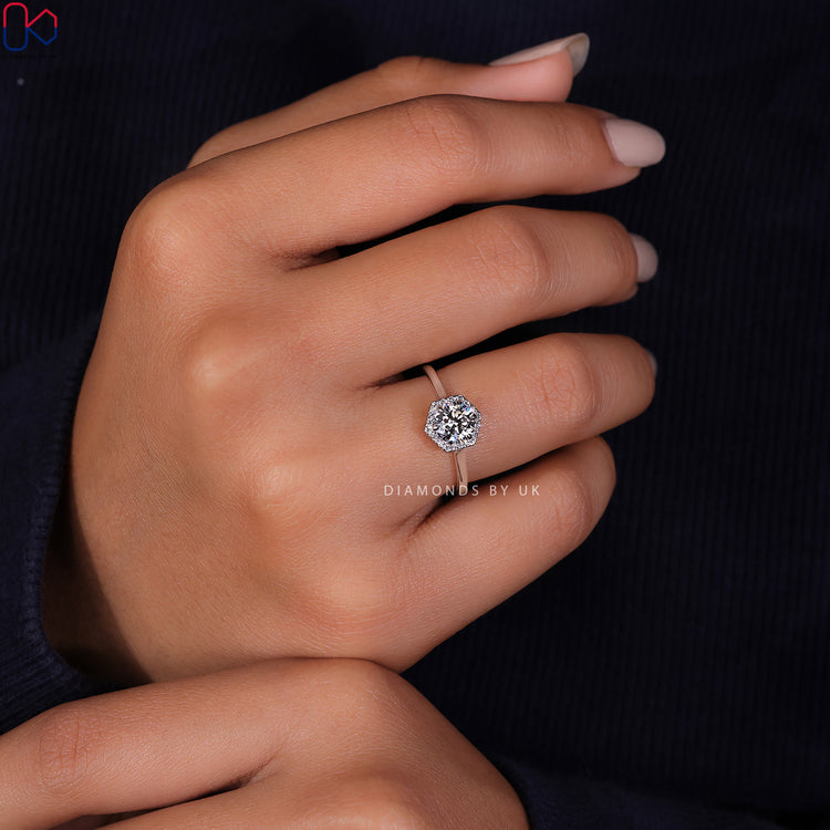 Lab Grown Diamond round cut stone set in a timeless white gold engagement ring.
