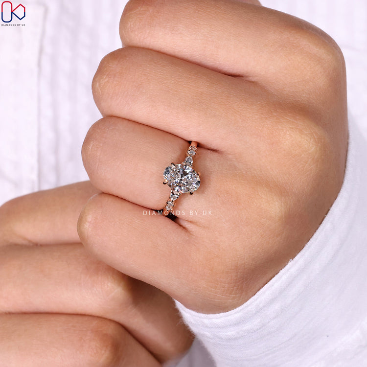 Pear and round side stone ring in 4 claw prong setting.
