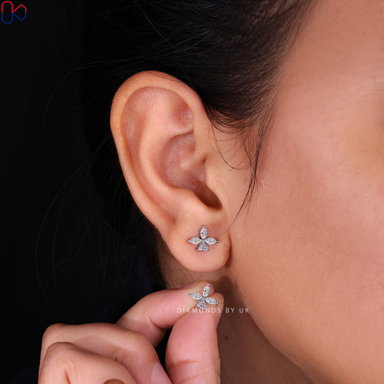 Diamondsbyuk earrings featuring a delicate floral design.
