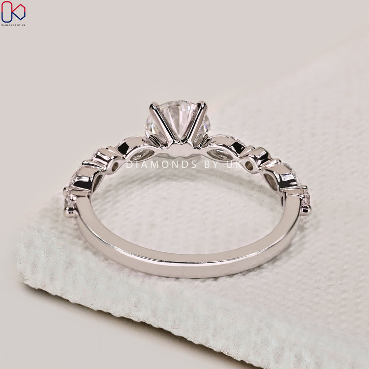 4 claw prong setting ring with handmade white gold band.

