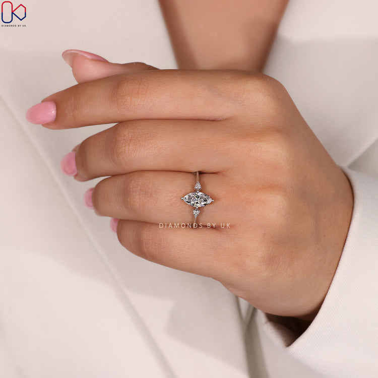 3 Diamond Engagement Ring featuring a marquise diamond center.

