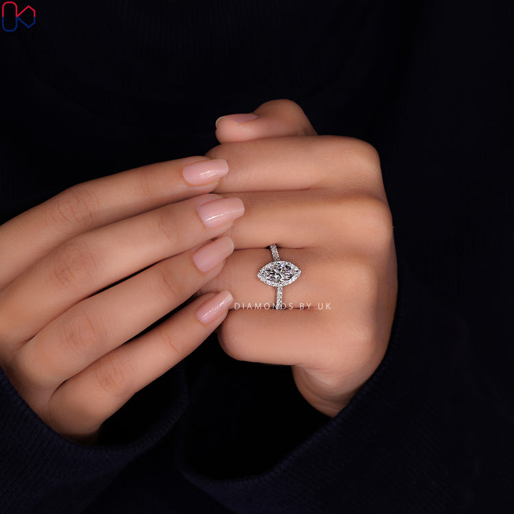 Prong setting ring highlighting a marquise diamond with secure placement.
