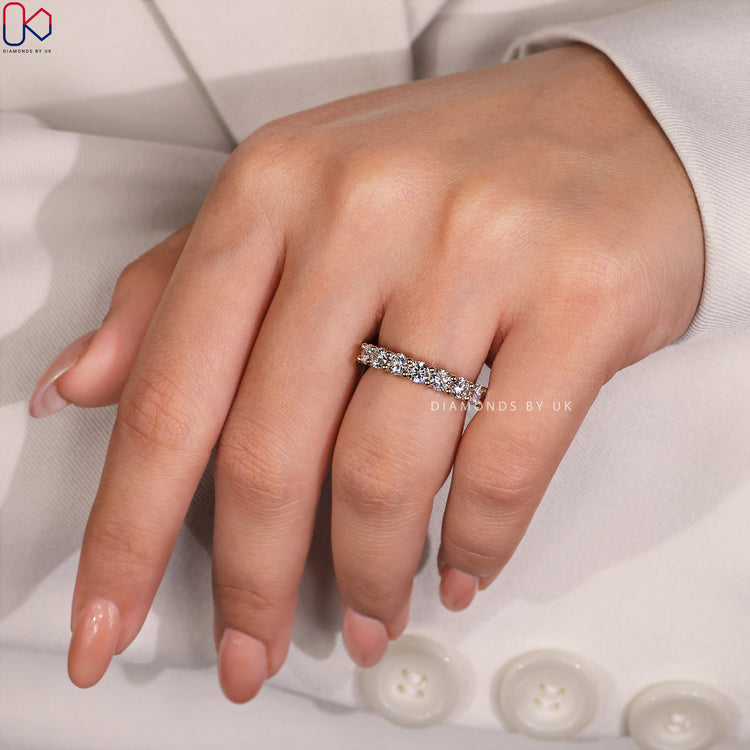 Pave set band with round diamonds creating a continuous sparkle.