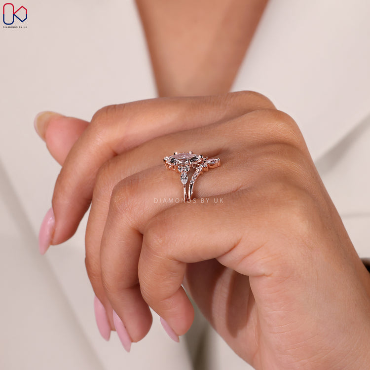 6 claw prong setting ring securing a central marquise diamond.
