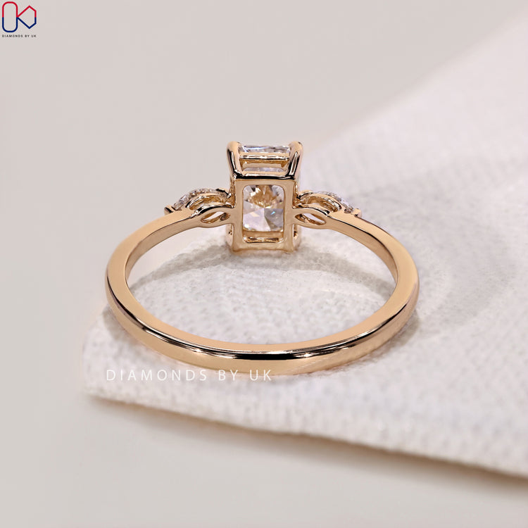 Engagement ring UK featuring a 3 stone ring with a Lab Grown Diamond and marquise cuts.
