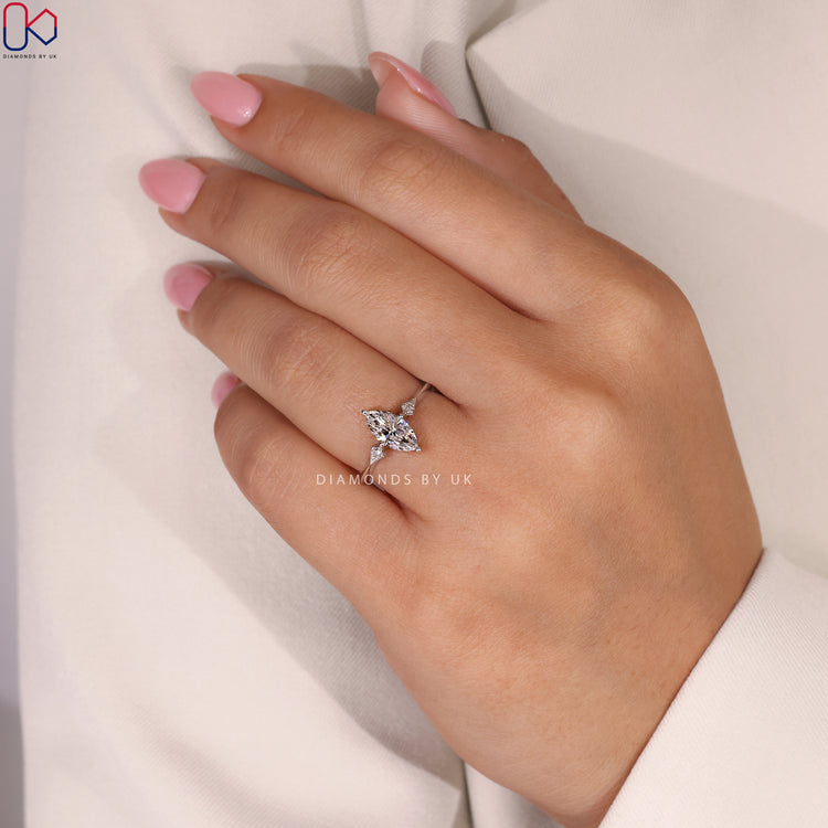 Diamondsbyuk Engagement Ring featuring marquise and round diamonds.