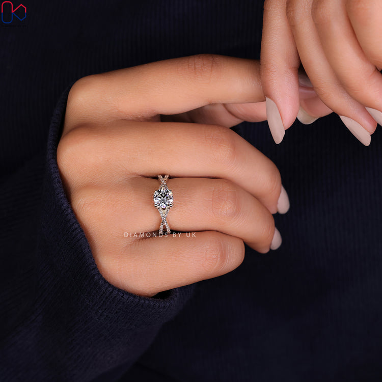 Twisted pave ring with a captivating design and side stone engagement ring accents.